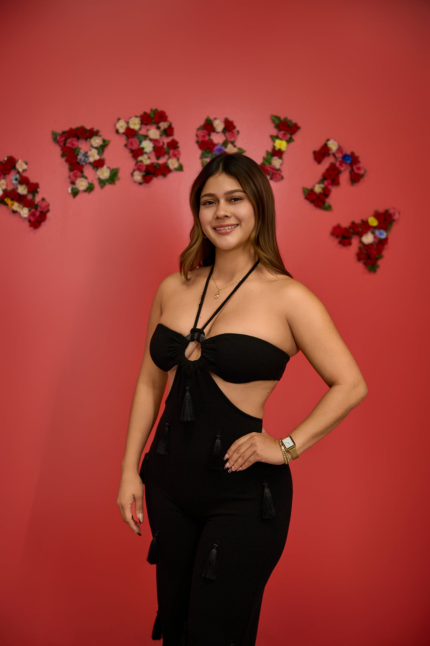 Black fitted jumpsuit with side cuts and neckline