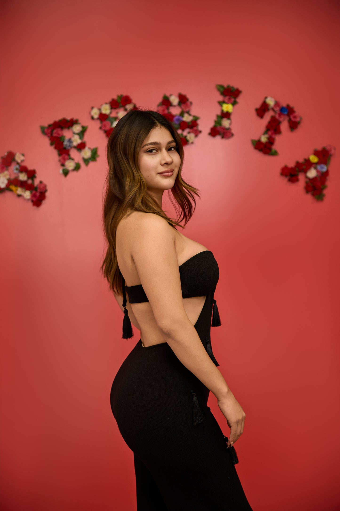 Black fitted jumpsuit with side cuts and neckline