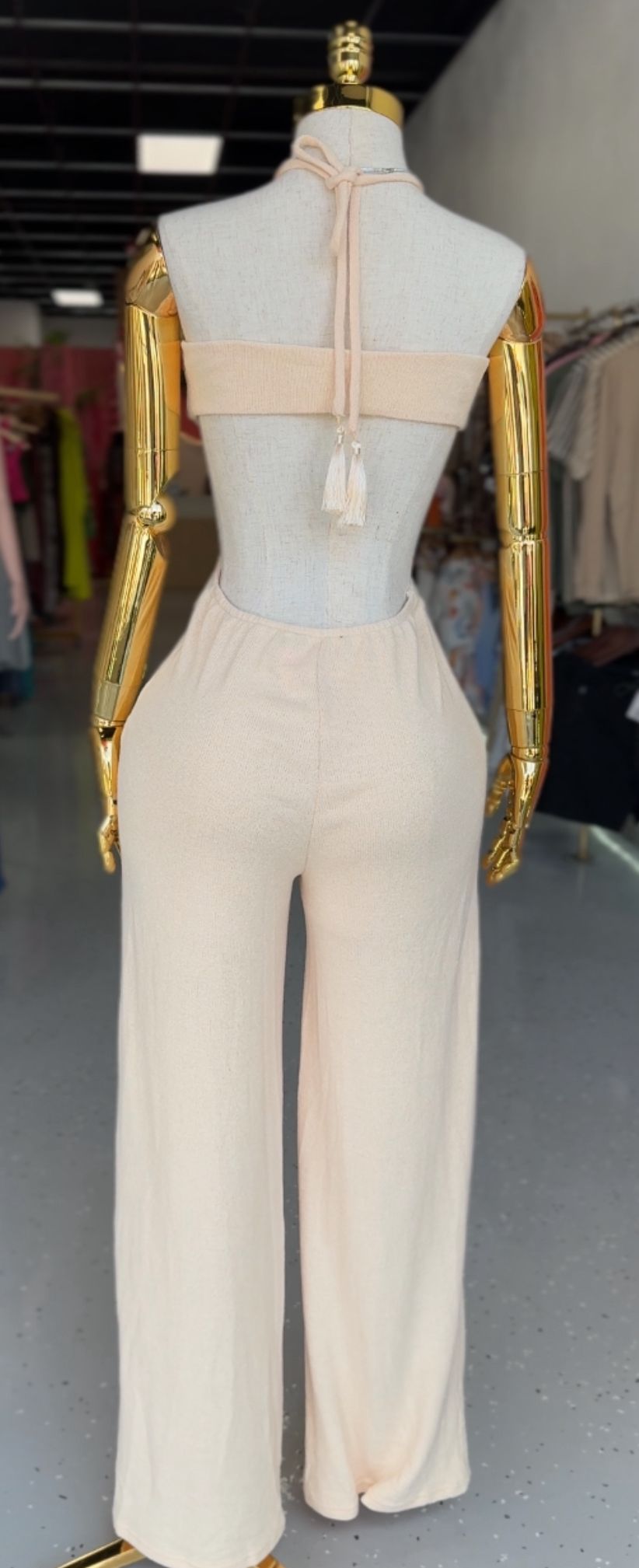 Black fitted jumpsuit with side cuts and neckline